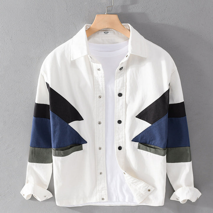 Herren Baumwoll-Overshirt im Layering-Stil mit geometrischen Colorblock-Einsätzen und Druckknopf-Leiste Echoarchiv