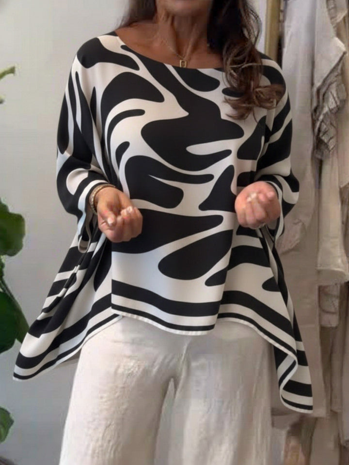 Damen Oversize Sommerbluse mit abstraktem Print, Fledermausärmeln und asymmetrischem Saum – Élovi