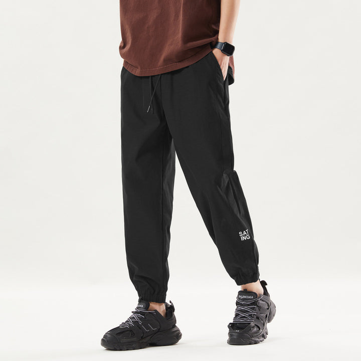 Herren Sportliche Jogginghose mit elastischem Bund und Reißverschlusstaschen Echo Archiv