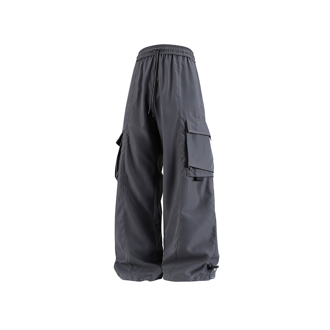Herren weite Utility‑Cargohose im Baggy‑Cut mit Tunnelzugbund, großen Klappentaschen und verstellbarem Beinabschluss Echo Archiv