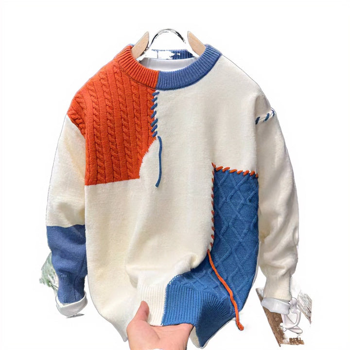 Unisex Patchwork-Oversize-Strickpullover mit Zopf- und Rautenmuster, dekorativen Kontrastnähten und Rundhalsausschnitt Echoarchiv