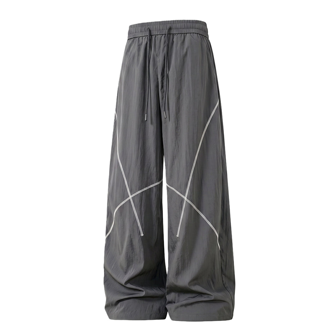 Herren Weite Funktions-Nylonhose mit Kordelbund, reflektierenden Nahtdetails & lässiger Baggy‑Silhouette Echoarchiv