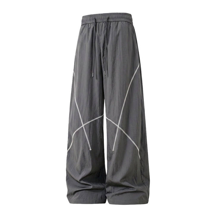 Herren Weite Funktions-Nylonhose mit Kordelbund, reflektierenden Nahtdetails & lässiger Baggy‑Silhouette Echoarchiv