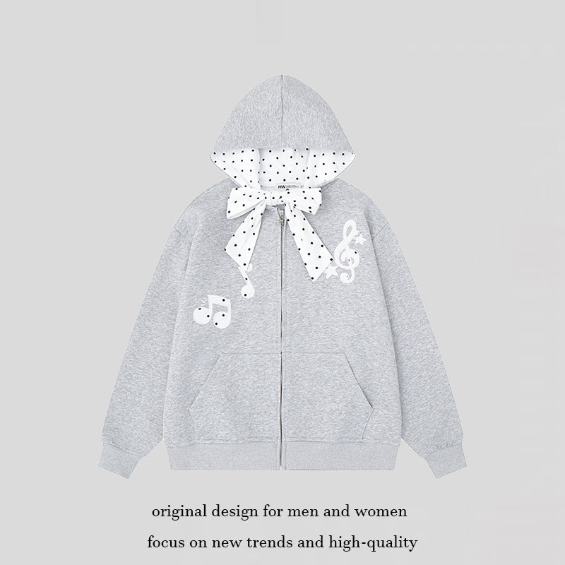 Damen Kapuzensweatjacke mit gepünktetem Kapuzenfutter, dekorativer Schleife und Notenmotiv Echoarchiv