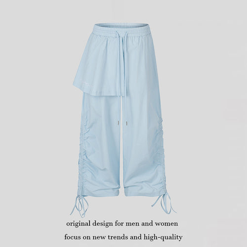 Damen Weite Capri-Hose mit Tunnelzug, seitlicher Raffung und asymmetrischer Überlagerung Echoarchiv