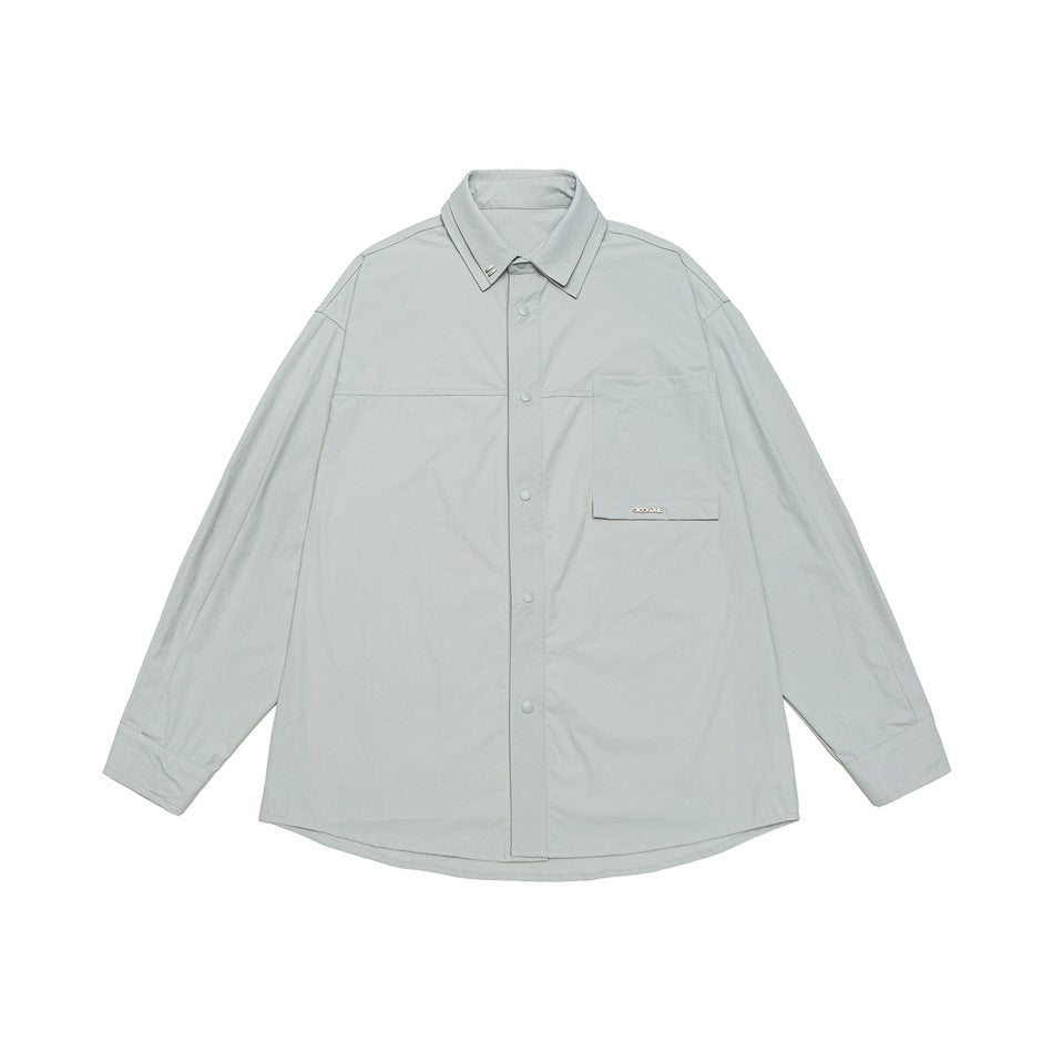 Unisex Oversize Hemd mit technischem Material, Brustklappe und gerundetem Saum Echoarchiv