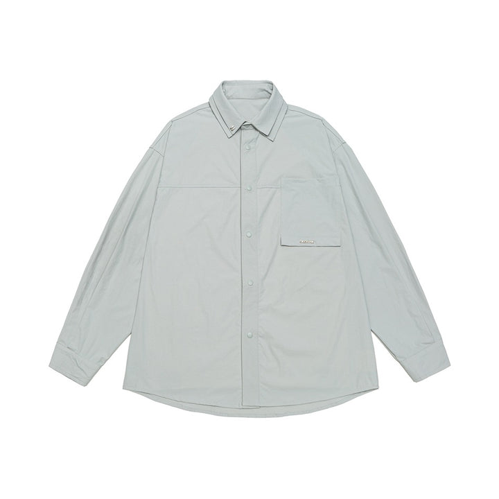 Unisex Oversize Hemd mit technischem Material, Brustklappe und gerundetem Saum Echoarchiv