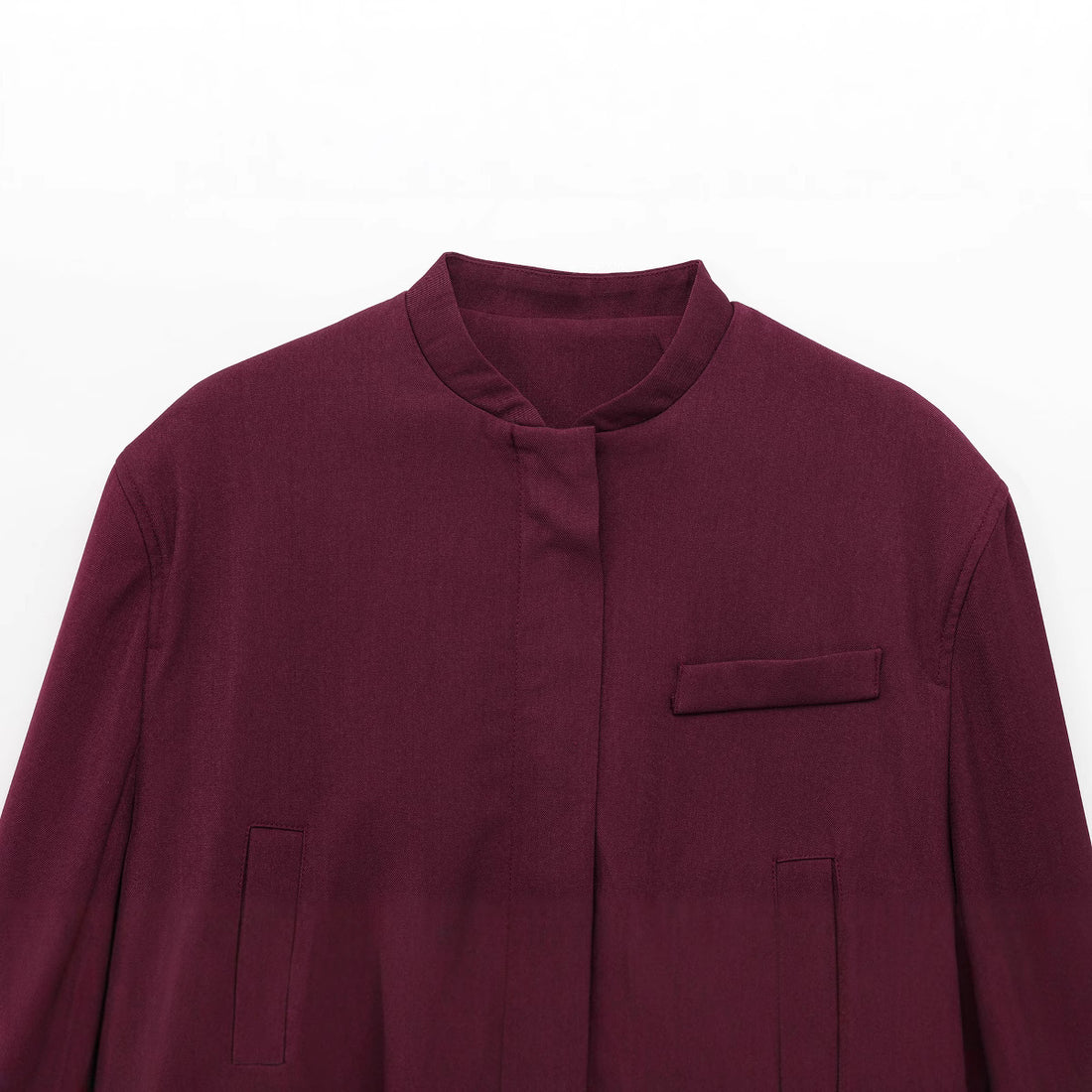 Damen kurze Stehkragen-Blousonjacke mit verdeckter Frontleiste, taillierter Rippbund-Details und dekorativen Paspeltaschen – Célinea