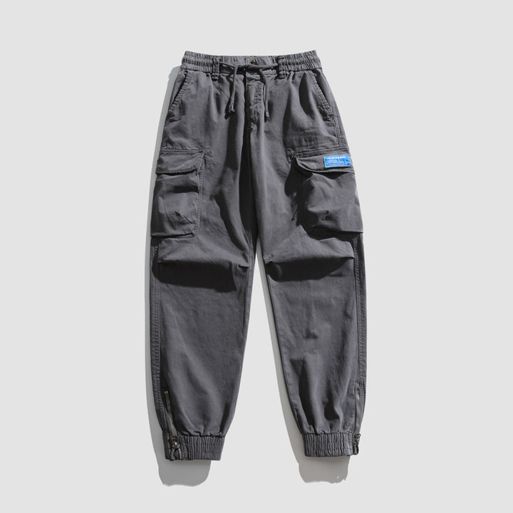 Herren Konisch geschnittene Utility-Cargo-Jogginghose mit Tunnelzugbund, Klapptaschen und Knöchelreißverschlüssen Echo Archiv