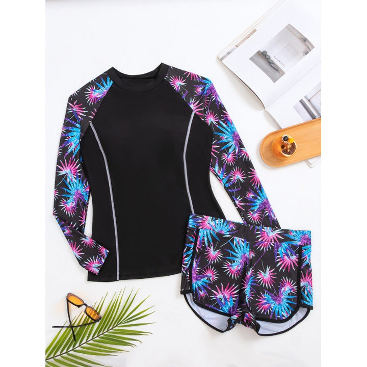 Damen Rashguard mit sportlichen Shorts und trendigem Blumenmuster Echo Archiv