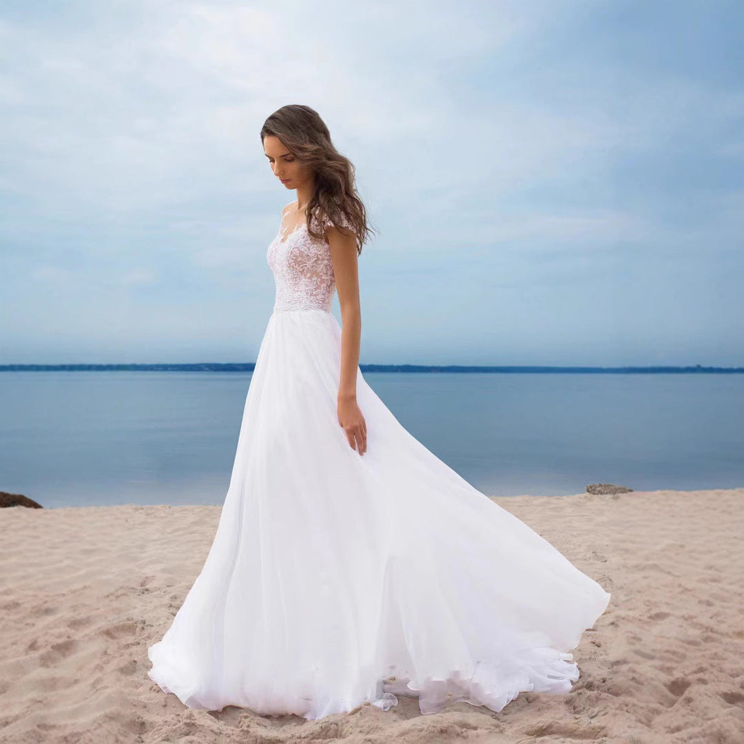 Damen Hochzeitskleid mit elegantem Spitzenoberteil und schwingendem Rock Echoarchiv