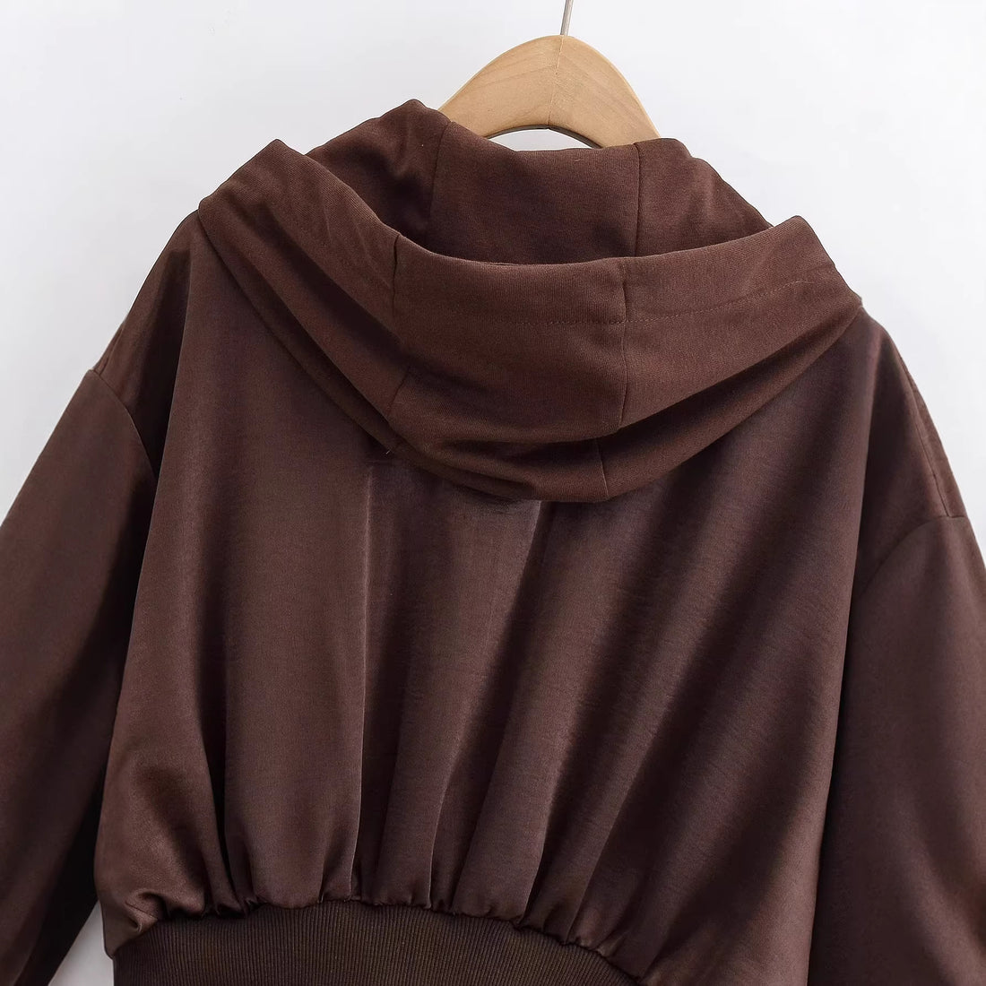 Damen Cropped Kapuzenjacke mit Reißverschluss, übergroßen Ärmeln und breitem Rippbund Echoarchiv