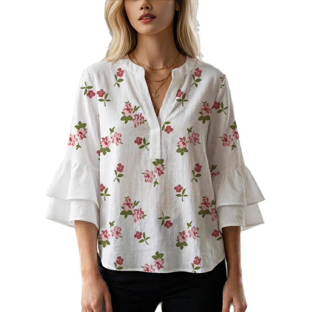 Damen Bluse mit voluminösen Rüschenärmeln und modernem Motiv Echo Archiv