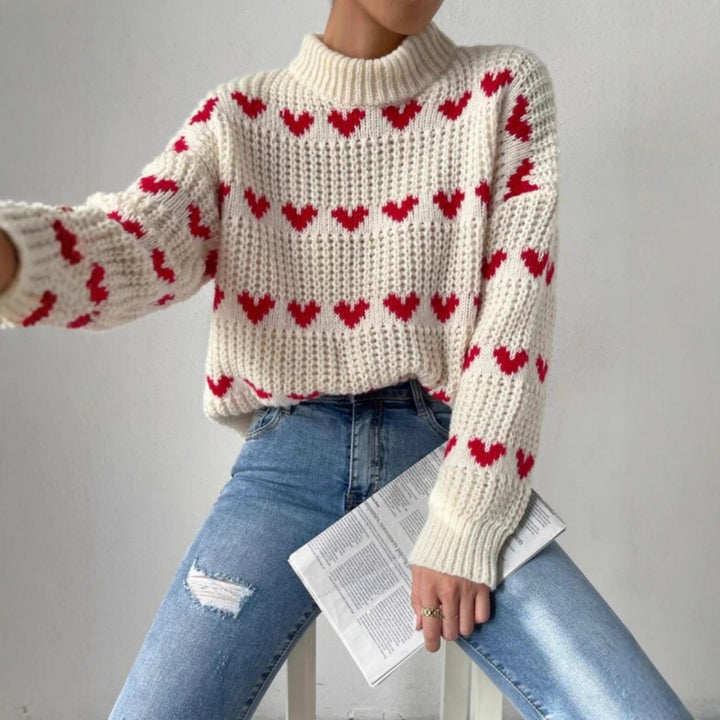 Damen nan Grobstrickpullover mit eingestrickten Herzmotiven, hohem Stehkragen und lässiger Oversize-Silhouette Echo Archiv