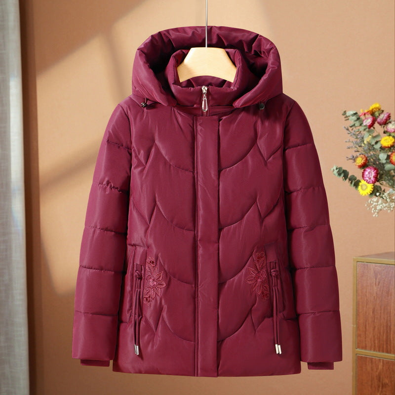 Damen gesteppte Thermo-Outdoorjacke mit ergonomischer Kapuze und floraler Taschenstickerei – Avérine