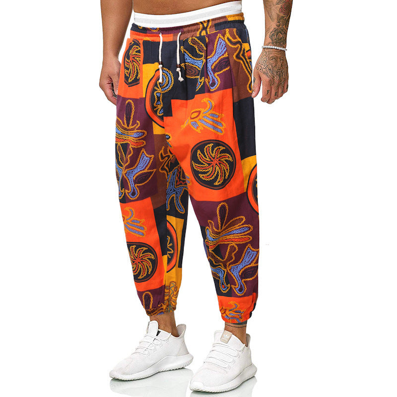 Herren Locker sitzende Patchwork-Loungehose mit Tunnelzug, elastischen Knöcheln und dekorativem Allover-Print Echo Archiv