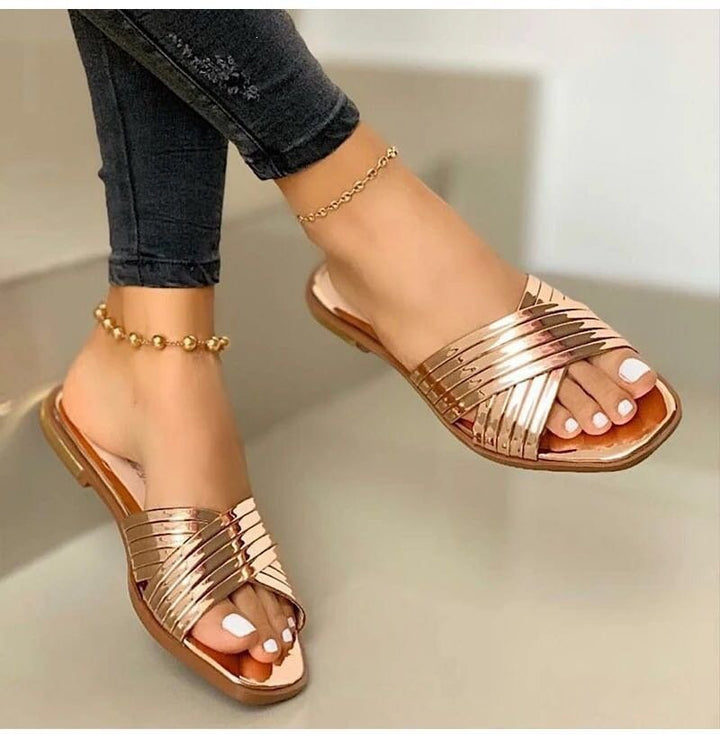 Damen Geflochtene Metallic-Slipper mit überkreuzten Riemen und flacher Komfortsohle – Lioré