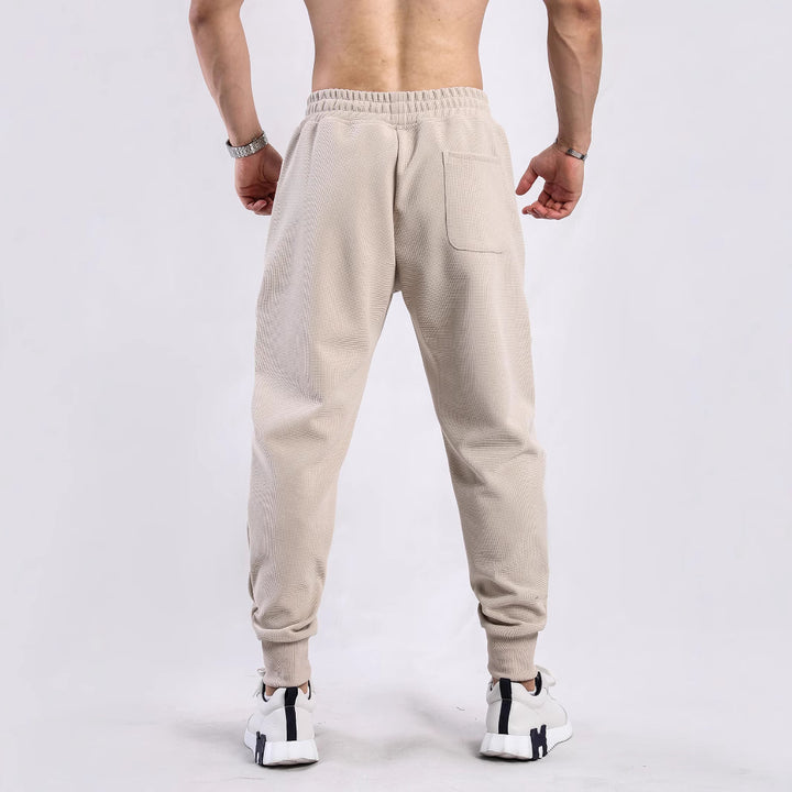 Herren Sportliche Jogginghose mit atmungsaktiven Einsätzen und elastischem Bund Echoarchiv