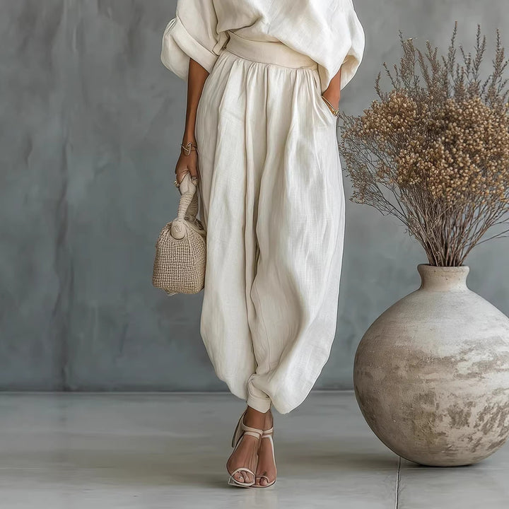 Damen Leinen-Set mit One-Shoulder-Oberteil und weiten Haremshosen Echoarchiv