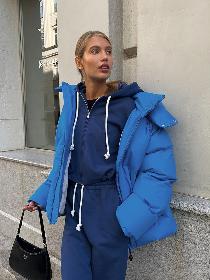 Damen Oversize Steppjacke mit Kapuze und wattierter Thermofüllung Echoarchiv