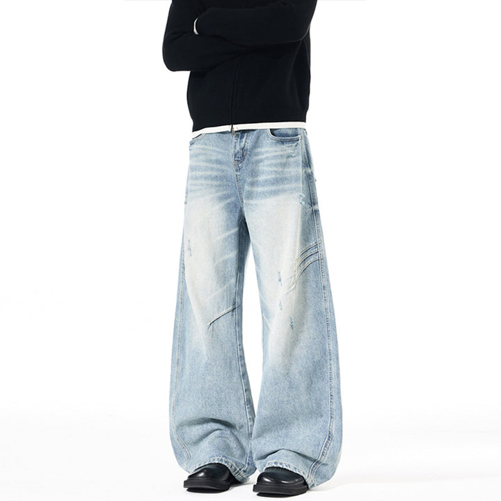Herren Ultraweite Denim-Palazzohose mit skulpturalen Seitenbahnen und Used‑Effekt Echo Archiv