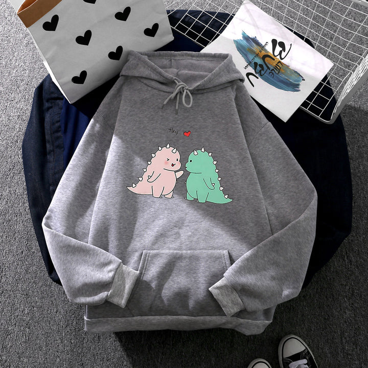 Damen Kapuzenpullover mit niedlicher Dinosaurierpärchen‑Illustration, Oversize‑Schnitt und Kängurutasche – Auréline