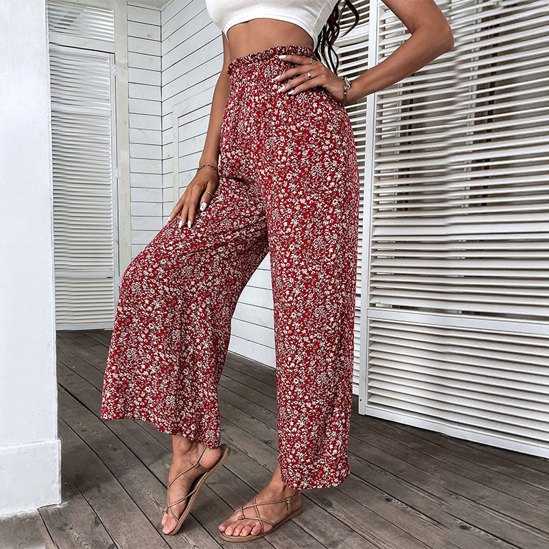 Damen Weite hochgeschnittene Palazzo‑Hose mit floralem Muster und seitlichem Beinschlitz Echoarchiv