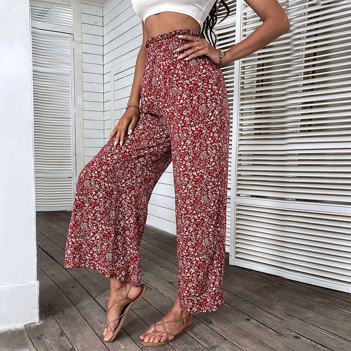 Damen Weite hochgeschnittene Palazzo‑Hose mit floralem Muster und seitlichem Beinschlitz Echoarchiv