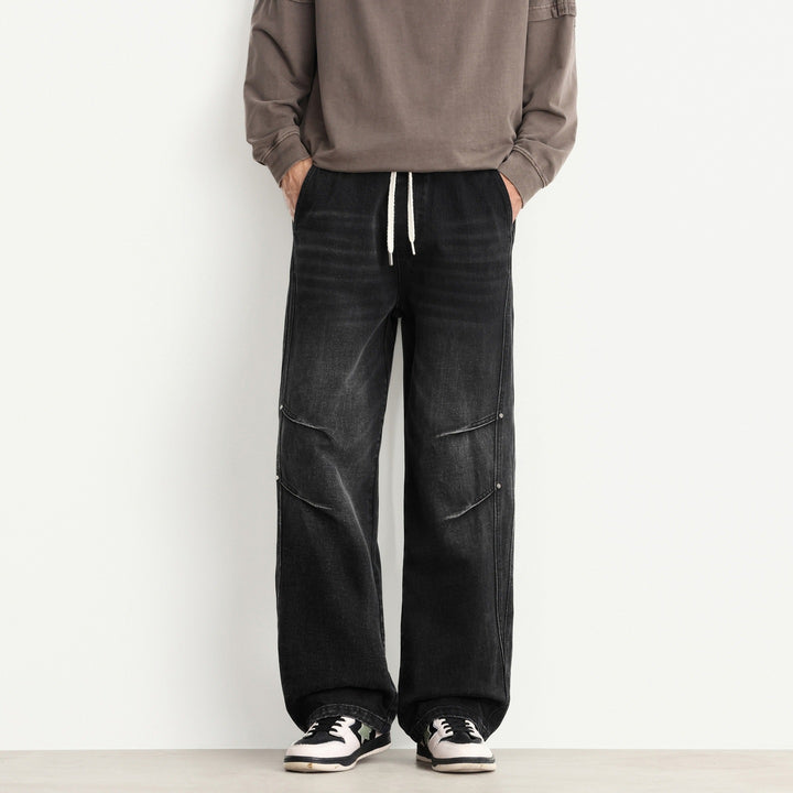 Herren Weite Denim-Hose mit Tunnelzugbund, Paneelnähten und Used-Waschung Echo Archiv