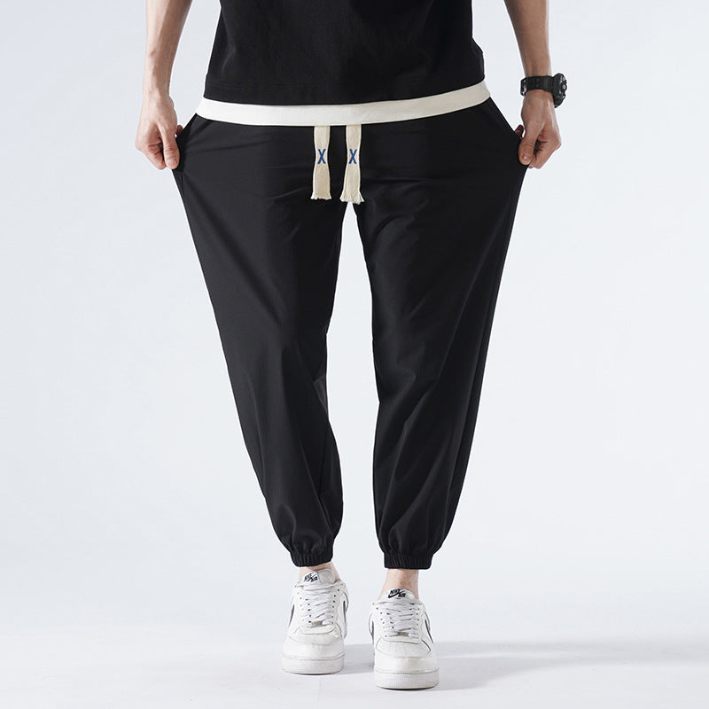 Herren Leichte Relax-Fit-Loungehose aus atmungsaktivem Jersey mit elastischem Tunnelbund, breitem Kordelzug & geripptem Beinabschluss Echoarchiv