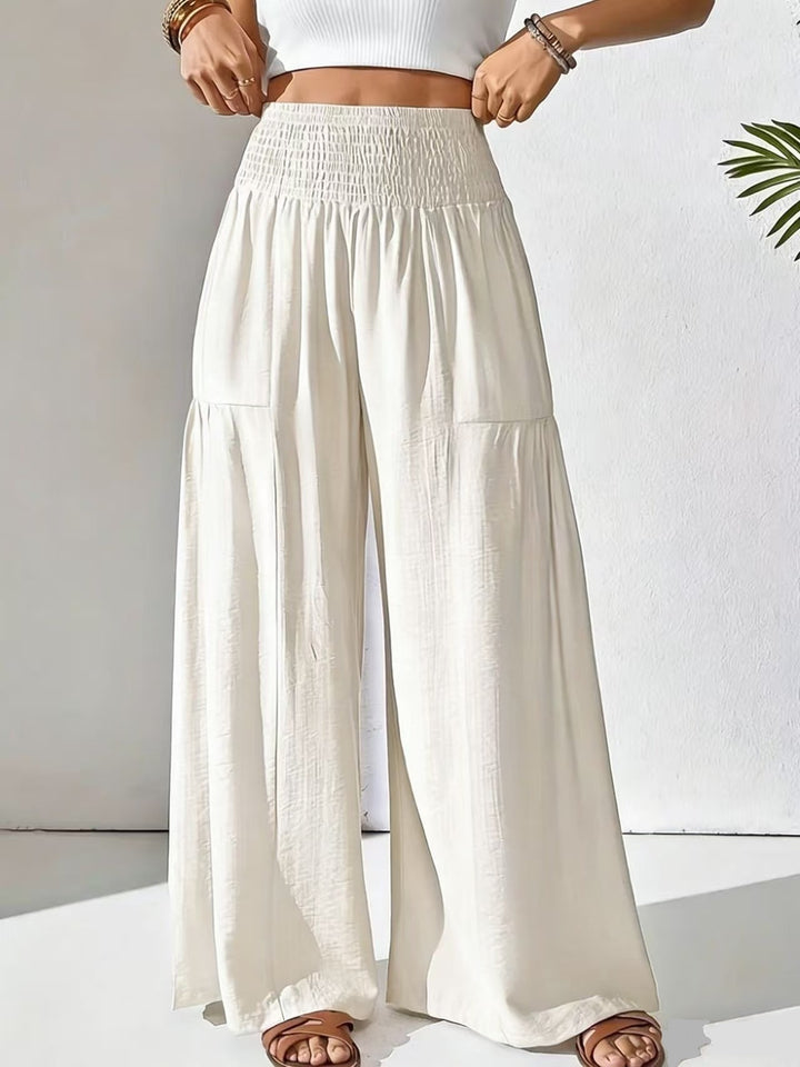 Damen weite Palazzo-Hose mit gerafftem Smock-Bund und Stufendetails – Avélisse