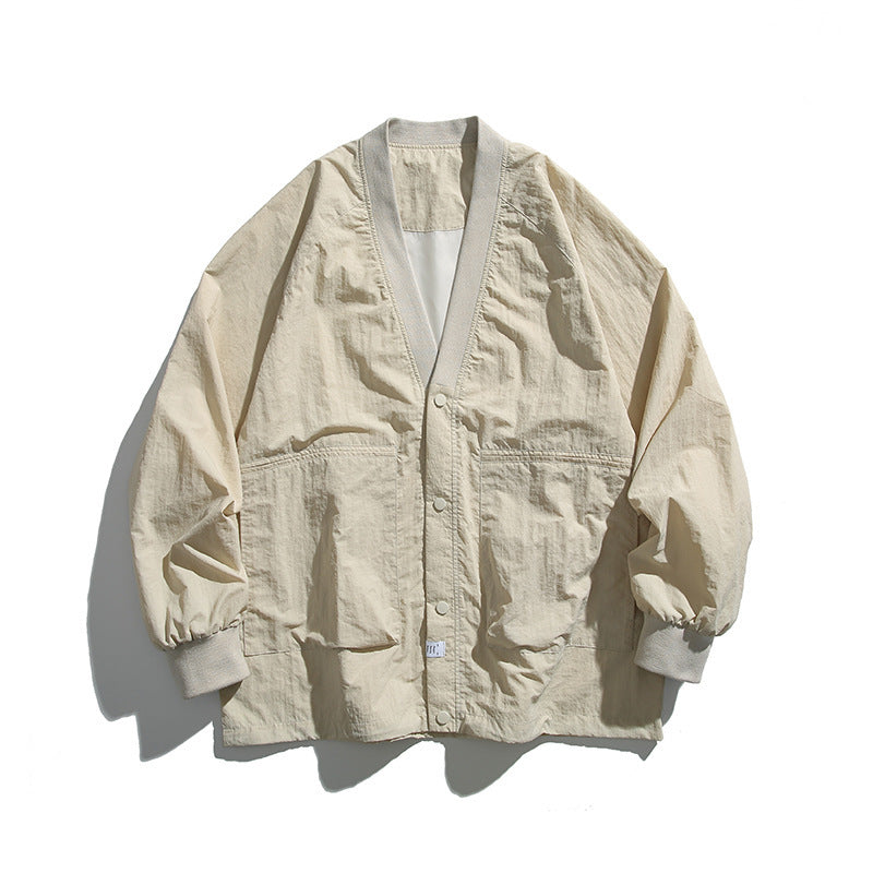 Unisex Weitgeschnittene Leichte Übergangsjacke mit V-Ausschnitt und Druckknopfleiste Echo Archiv