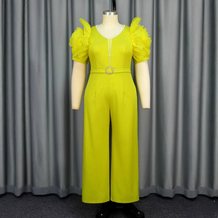 Damen eleganter Jumpsuit mit voluminösen Puffärmeln und Perlenakzent Echo Archiv