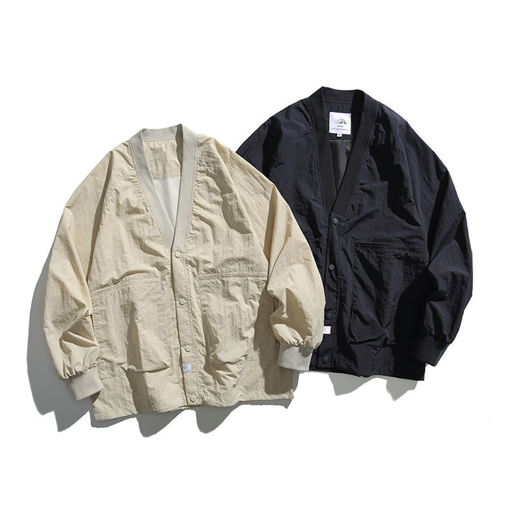 Unisex Weitgeschnittene Leichte Übergangsjacke mit V-Ausschnitt und Druckknopfleiste Echo Archiv