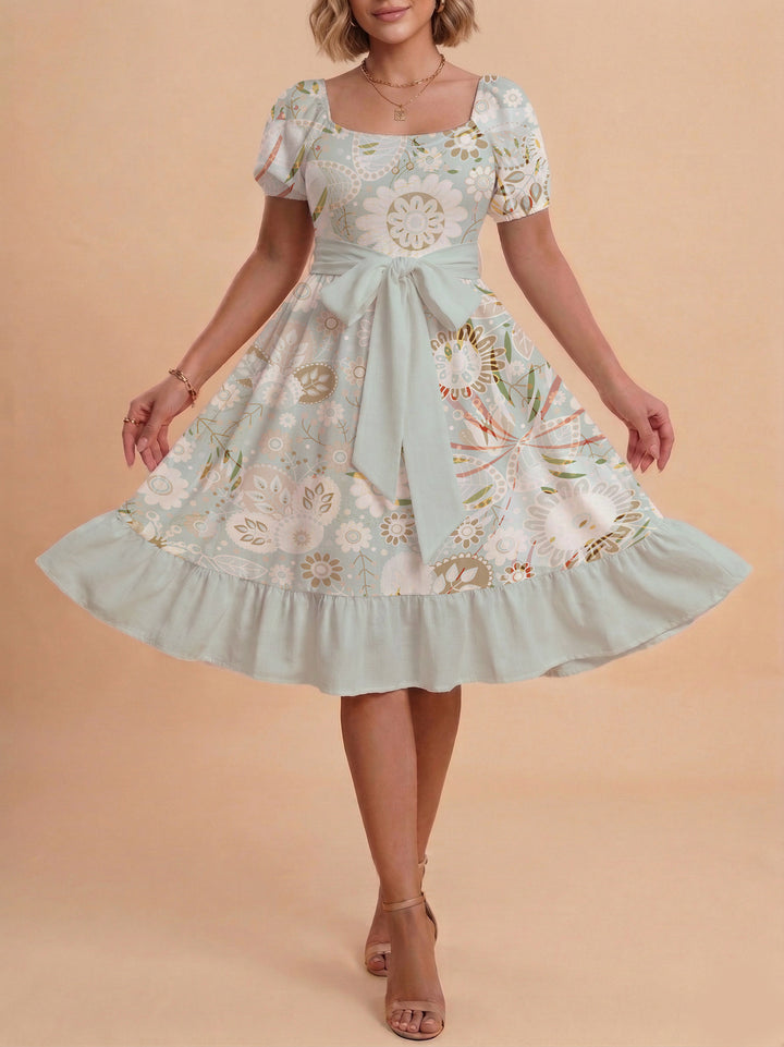 Damen modernes Blumenkleid mit elegantem Taillengürtel und asymmetrischem Saum Echo Archiv