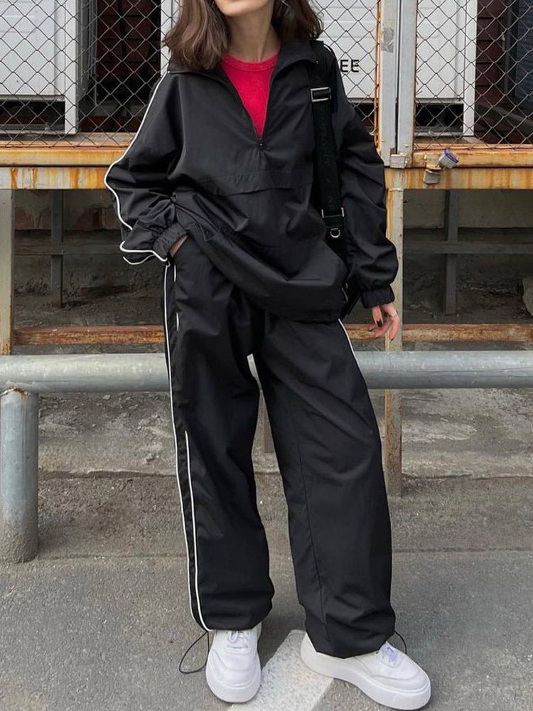 Damen winddichter Crop-Halfzip-Trainingsanzug mit elastischem Bund und kontrastierender Paspel – Avérine