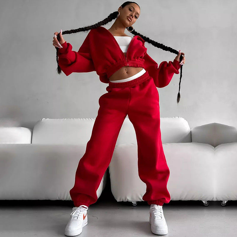 Damen Taillierter Zip-Overall im Loungewear-Stil mit Kapuze, Balloonärmeln und hoher Bundkante – Solévia