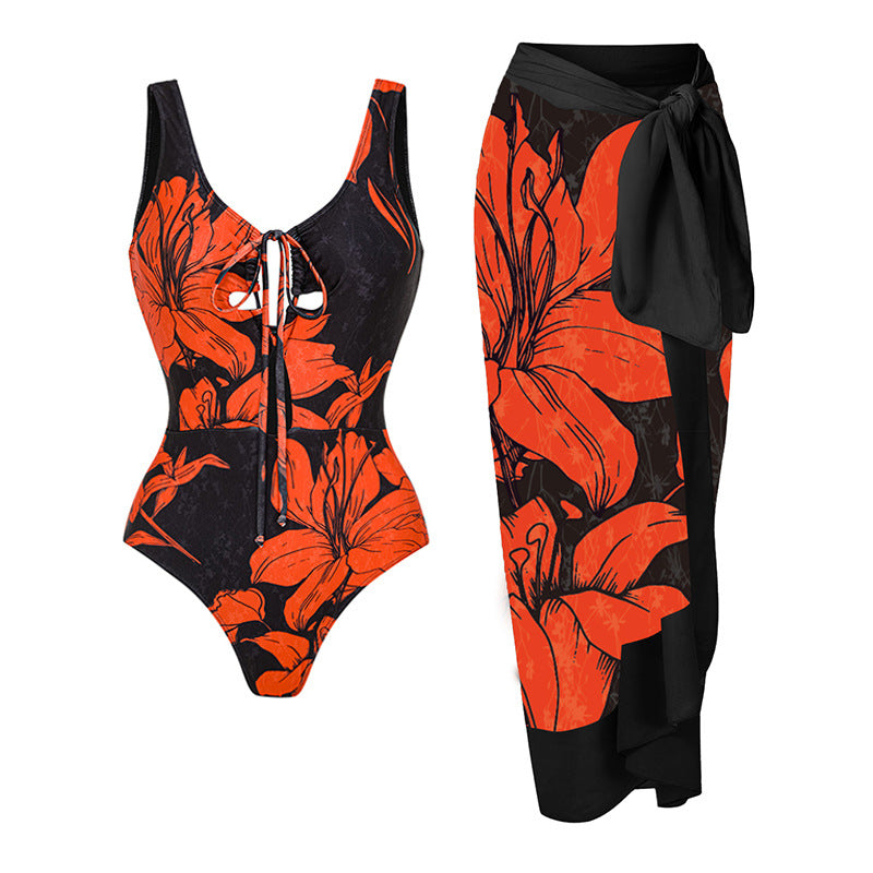 Damen Badeanzug mit asymmetrischem Schnitt und floralen Akzenten Echo Archiv
