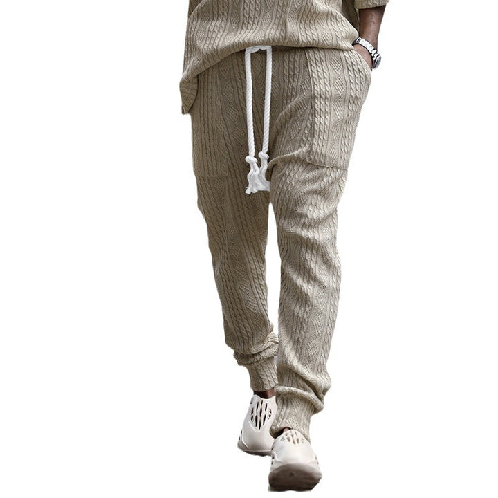 Herren nan gestrickte Jogginghose mit Zopfmuster, gekordeltem Tunnelzug und gerippten Beinabschlüssen Echo Archiv