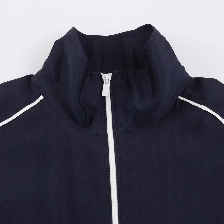 Damen Cropped Windbreaker-Jacke mit hohem Funnelkragen, Kontrastpaspel und elastischem Saum Echoarchiv