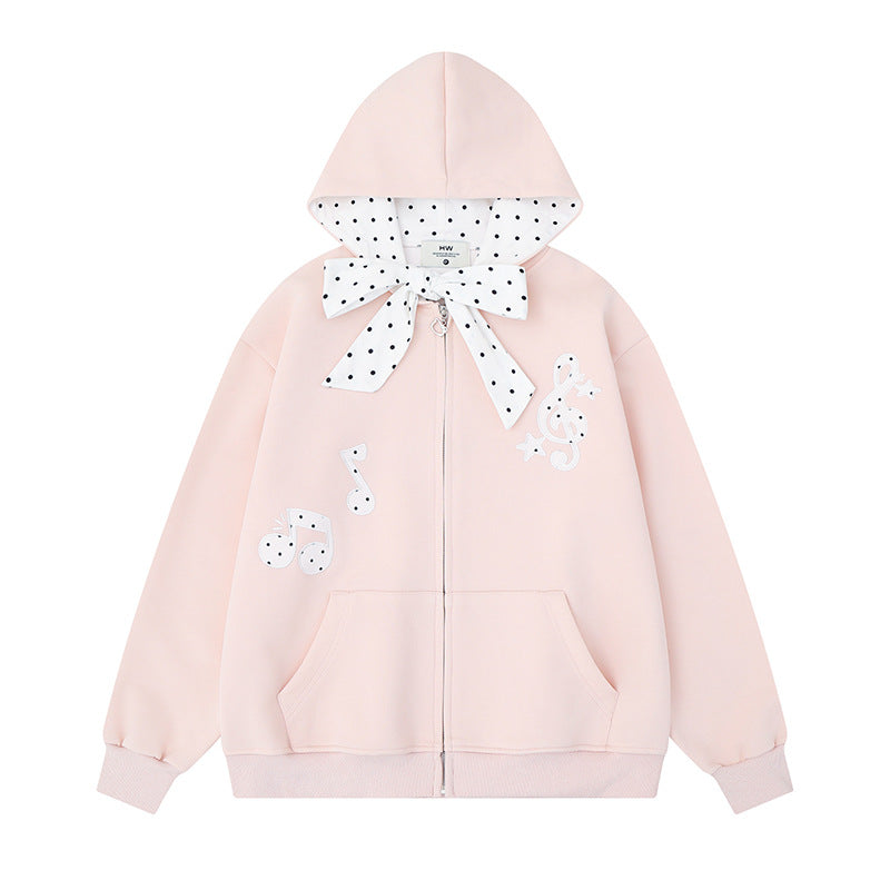 Damen Kapuzensweatjacke mit gepünktetem Kapuzenfutter, dekorativer Schleife und Notenmotiv Echoarchiv