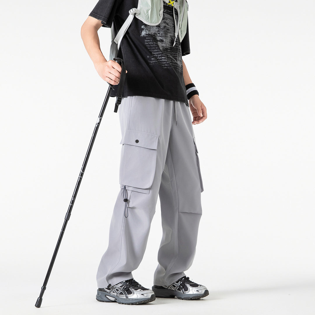 Herren Baggy‑Cargohose im Tech‑Utility‑Stil mit elastischem Tunnelzugbund, großen Klappfächern und Zipper‑Details Echo Archiv