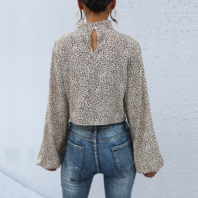 Damen Kurzbluse mit Drehfront, Stehkragen, Ballonärmeln und Animal‑Muster Echoarchiv