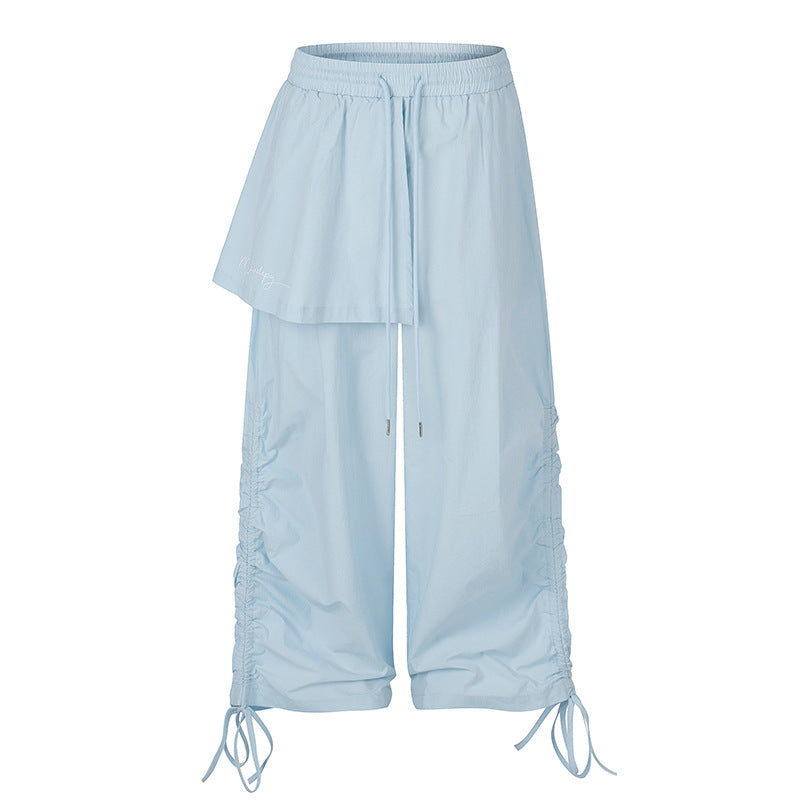 Damen Weite Capri-Hose mit Tunnelzug, seitlicher Raffung und asymmetrischer Überlagerung Echoarchiv