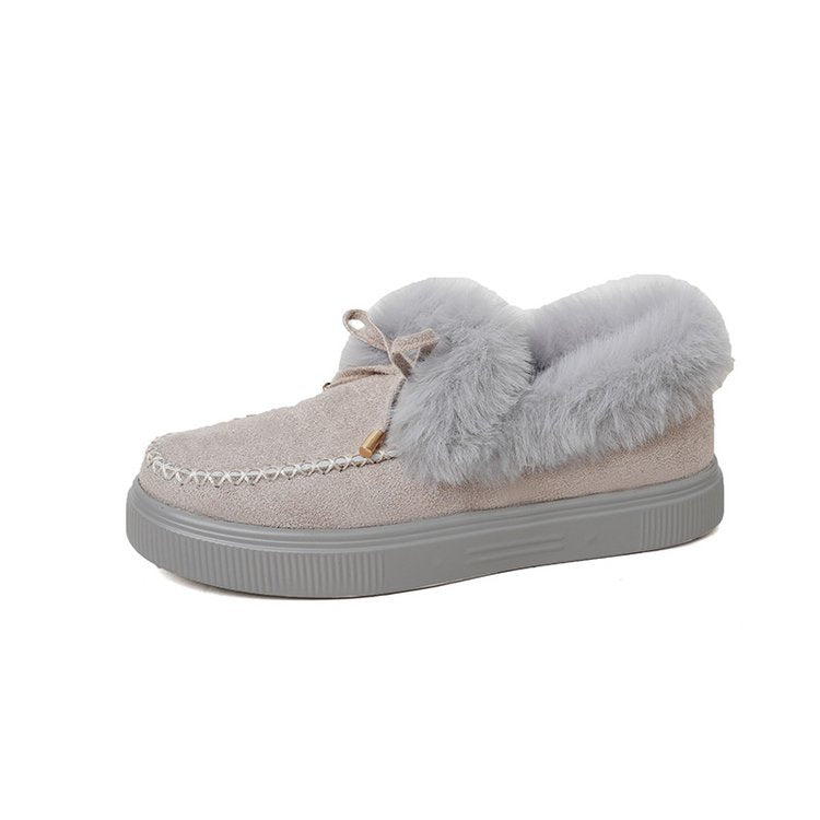 Damen Kuschel‑Mokassin‑Slipper mit hochfloriger Fellmanschette, dekorativer Steppnaht und leichtem Plateau‑Sohlenprofil Echo Archiv