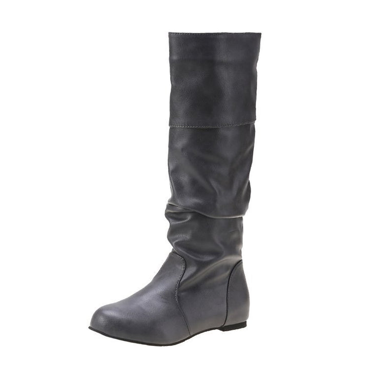 Damen Schlupfstiefel mit gerafftem Schaft und flacher Keilsohle – Varelle