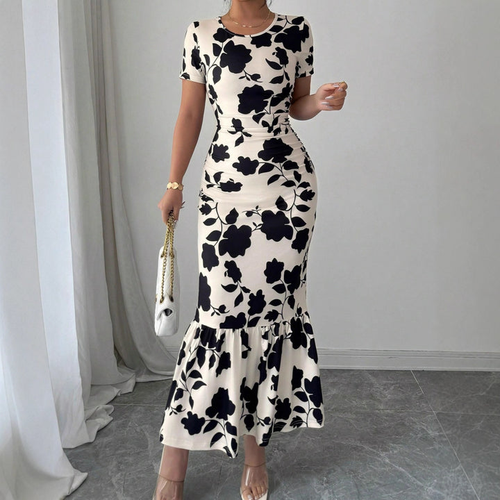 Damen Elegantes figurbetontes Kleid mit Rüschen-Saum und floralem Muster Echo Archiv