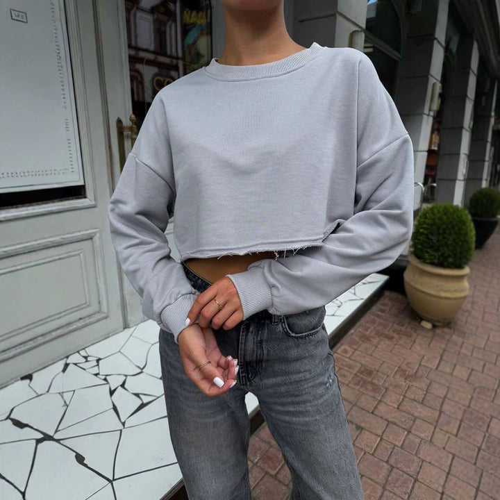 Damen Kurzgeschnittenes Sweatshirt mit ausfransendem Saum und überschnittener Schulter – Avérine