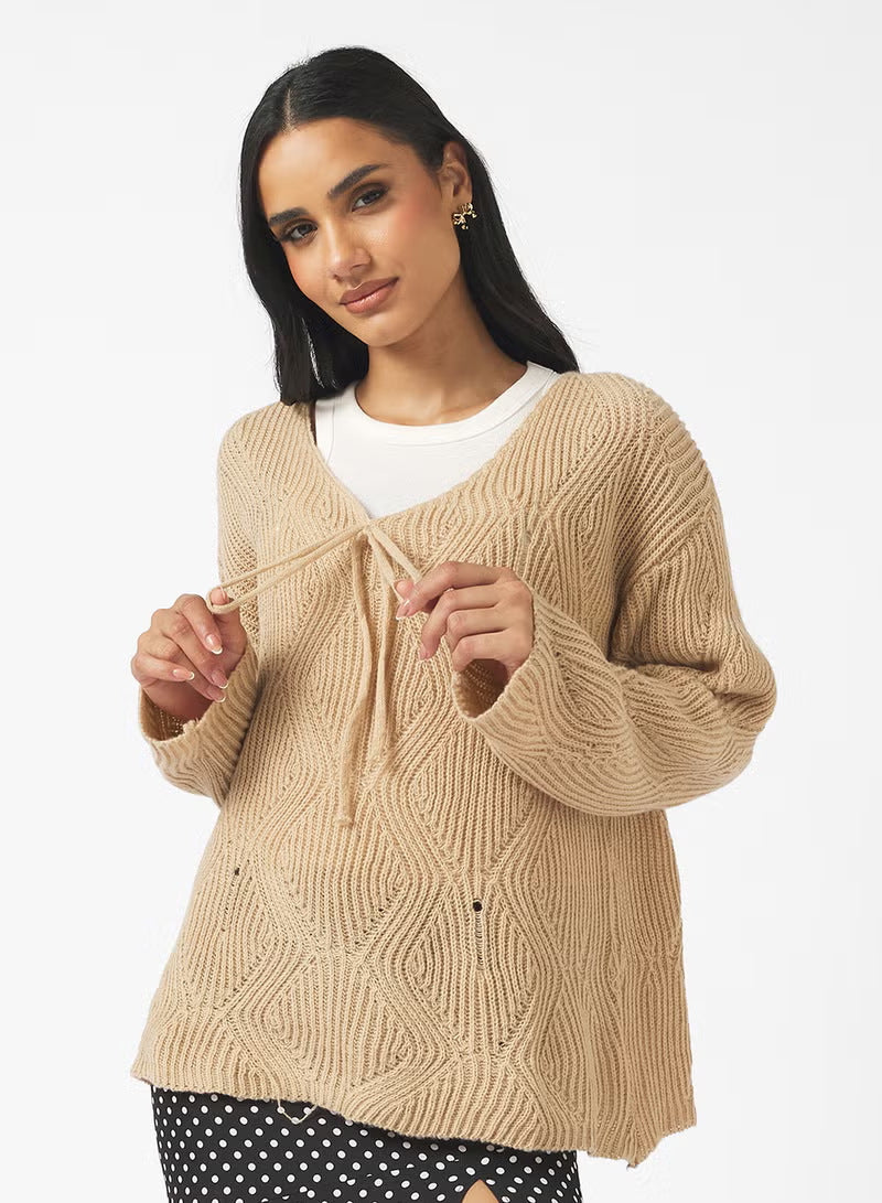 Damen Oversize Strickpullover mit V-Ausschnitt, Kordelzug und Rautenstruktur – Mavelle