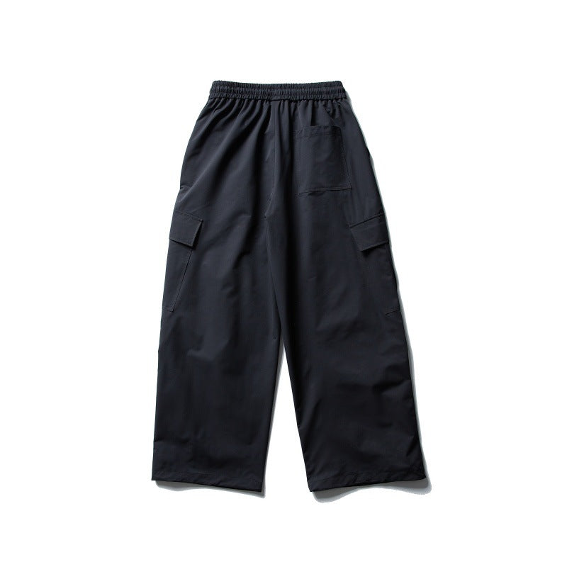 Unisex Weite Cargo-Utility-Hose im Baggy-Schnitt mit elastischem Kordelbund und großzügigen Klappentaschen Echoarchiv